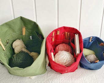 Gift for knitters! Organic canvas knitting bag/organizer with numerous pockets to hold all your supplies. Portable & eco-friendly. 3 sizes.
