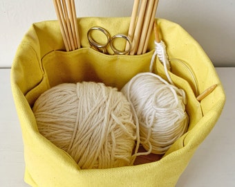 Small yellow knitting bag made of organic canvas with 8 pockets. Perfect for hat/sock projects. Portable & eco-friendly. Great gift idea!