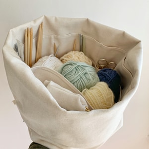 Medium knitting bag.  Natural organic canvas organizer/project bag, numerous pockets hold all your supplies. Portable & eco-friendly