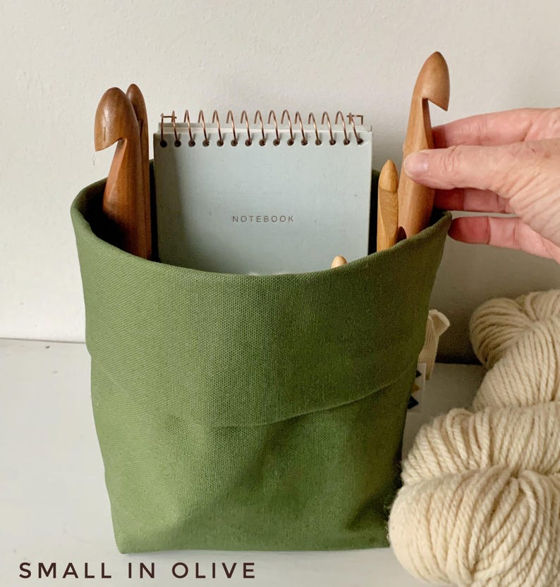 May include: A set of three ceramic mugs with a speckled, matte finish. The mugs are in shades of cream, light gray, and dark gray. Each mug has a simple, minimalist design, perfect for coffee or tea.