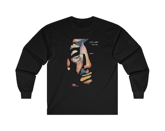 May include: Black long-sleeve t-shirt with a colorful abstract portrait of Leonard Cohen. The text "Leonard Cohen" is printed in white below the portrait.