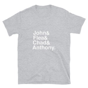 May include: A heather gray t-shirt with white text that reads "John & Flea & Chad & Anthony."