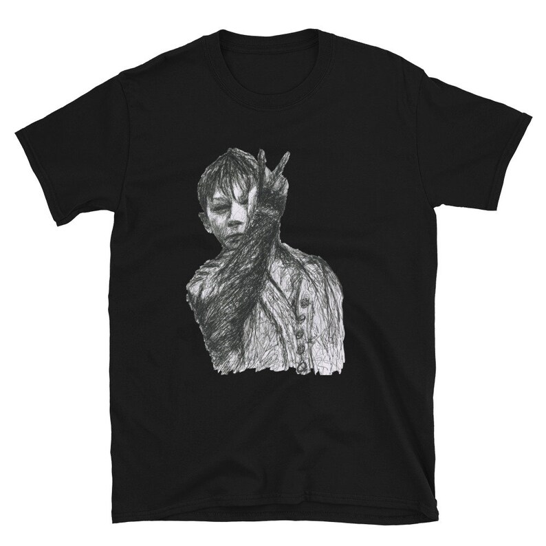 May include: Black t-shirt with a grayscale drawing of a person with their hand covering their face.