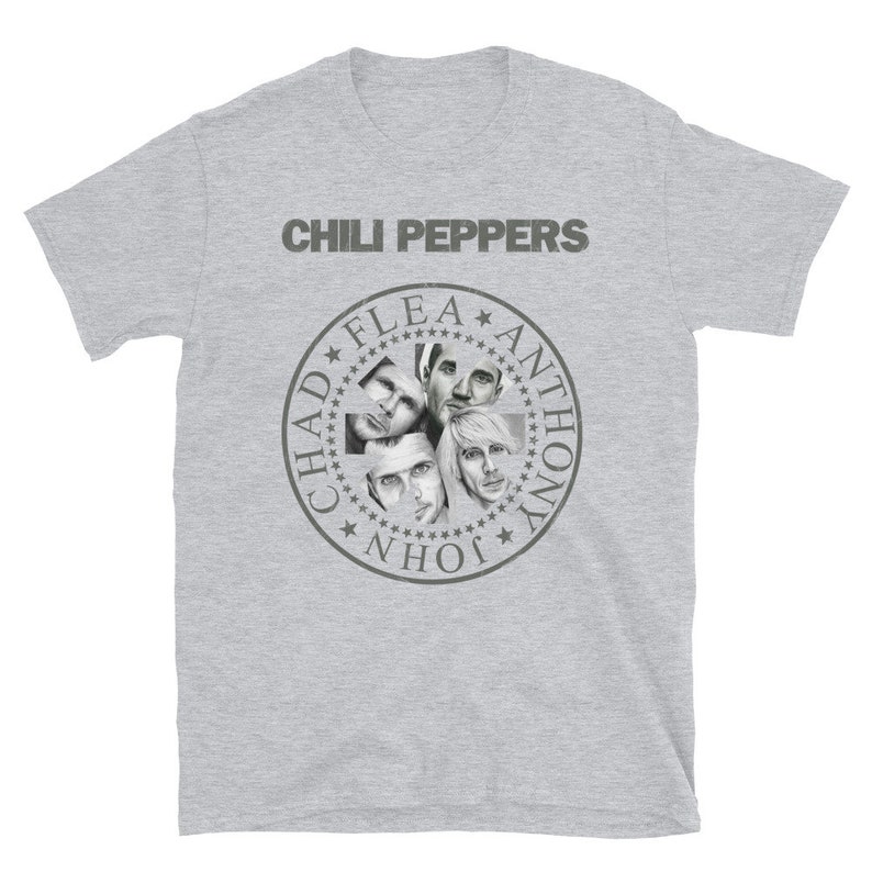 May include: A gray t-shirt with the words "Chili Peppers" printed in black at the top. Below the text is a circular design with the names "Chad", "Flea", "Anthony", and "John" printed around the edge. The center of the circle features black and white images of the band members.