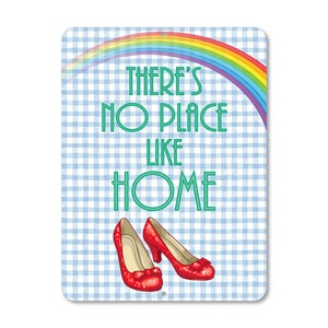 May include: A blue and white checkered sign with a rainbow and the text "There's No Place Like Home".  Two red ruby slippers are at the bottom of the sign.