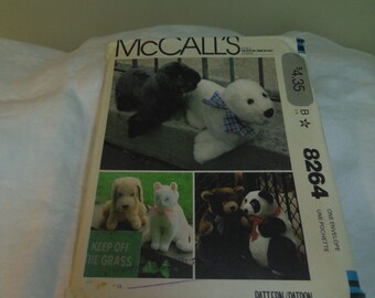 Uncut and factory fold. McCalls 8264 stuffed dog bear cat and seal pattern