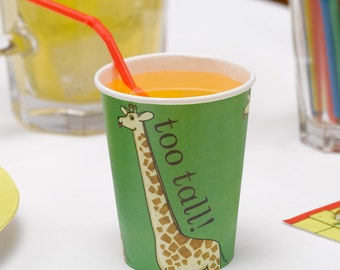 May include: A green paper cup with a giraffe illustration and the text "too tall!" printed on it. The cup is filled with orange juice and a red straw is sticking out of it.