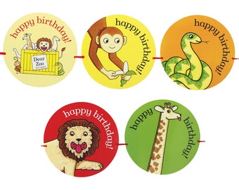 May include: A colorful garland with five round paper circles featuring different animals from the book "Dear Zoo". Each circle has the text "happy birthday!" written around the edge.