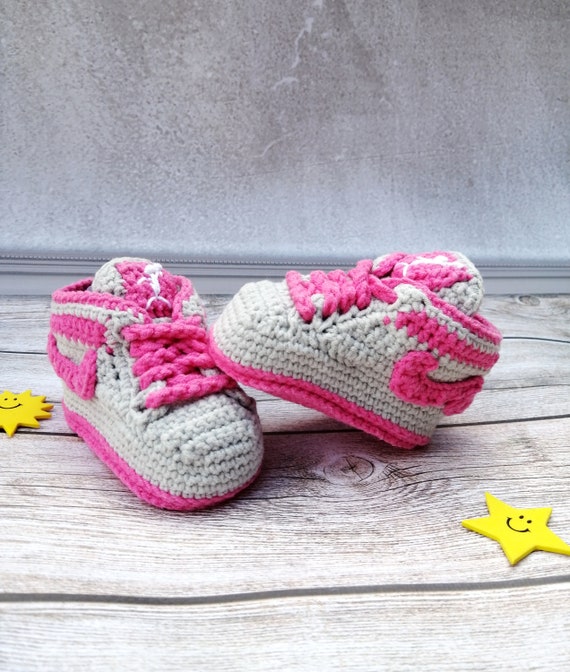 Crocheted baby booties sneakers. Baby 