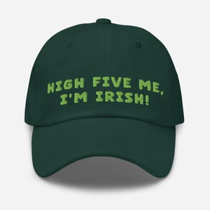 May include: A dark green baseball cap with the text "High Five Me, I'm Irish!" embroidered in light green.