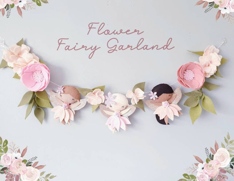 The garland features three pink felt fairies with glitter wings and different colour hair and skin tone. Each has a hand embroidered face and lightly blushed cheeks. On each side of the fairies are large pink felt flowers.