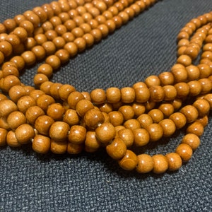 Long collier de perles en bois unisexe - Collier de perles bohème fait main, design naturel tribal, accessoire de mode en bois sans métal pour homme ou femme
