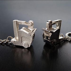 Llavero portátil de aleación metálica con rayos X 3D.