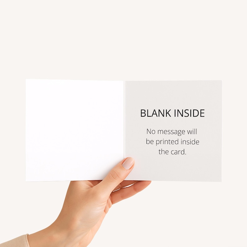 May include: A white greeting card held open, showing a blank interior. The right side of the card has the text "BLANK INSIDE" and the statement "No message will be printed inside the card."