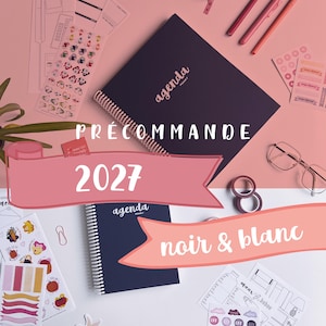 May include: A dark-coloured spiral-bound agenda with the word agenda printed on the cover, surrounded by various stationery items including sticker sheets, three pens, a roll of washi tape, and glasses, with text overlays reading PRÉCOMMANDE 2027 and noir & blanc.