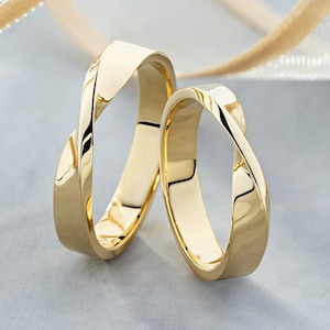 Mobius Wedding Bands His and Hers. Matching couple rings. Gold wedding band sets. 14k Gold Infinity Wedding Ring Set. Twisted Gold Bands