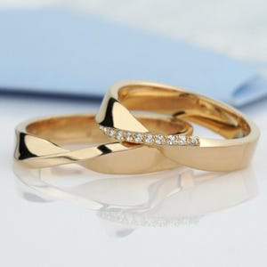 Gold Mobius Wedding Bands with natural diamonds. His and Hers Mobius wedding rings set. Matching gold wedding bands. Couple rings set.