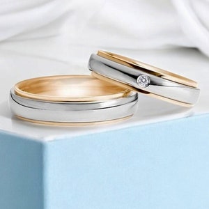 Matching two-tone wedding bands with diamond. Matching wedding rings set. His and hers wedding bands. Couples wedding bands set.