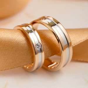 Matching wedding bands made of two colors of gold.