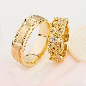 Gold wedding rings set. Couple wedding bands with unique design