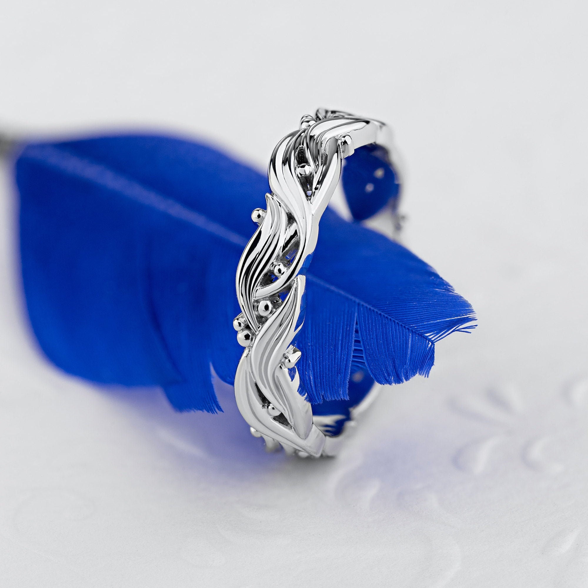 Blue feather engagement ring best sale
