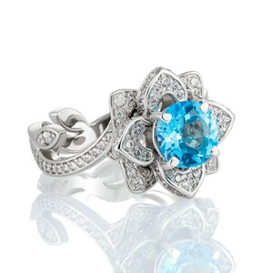 Gorgeous lotus flower ring with natural topaz. Blue Topaz Ring. Flower engagement ring.
