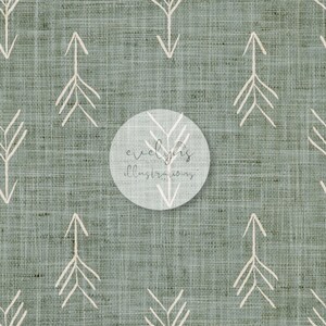 May include: A seamless pattern featuring white stylized arrows on a sage green linen background. The pattern is repeated throughout the image.