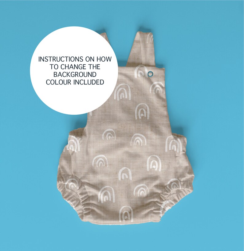 May include: A beige baby onesie with a white rainbow pattern. The onesie has a snap closure at the crotch and adjustable straps. Instructions on how to change the background color are included.