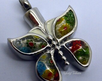 May include: A silver butterfly pendant with colorful glass wings. The wings are decorated with a variety of colors, including red, green, blue, and yellow. The pendant is attached to a silver chain.