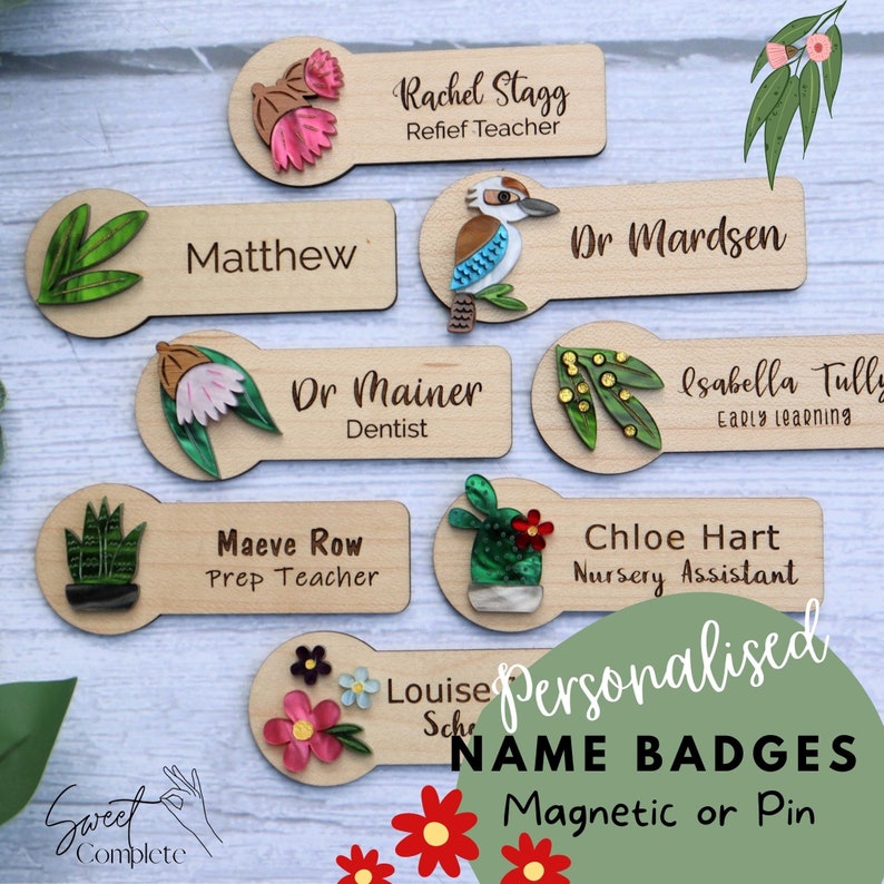 May include: A set of personalized wooden name badges with various designs, including flowers, plants, and animals. The badges are labeled with names and titles, such as "Matthew", "Dr. Mainer", and "Chloe Hart". The text "Personalized Name Badges Magnetic or Pin" is also visible.