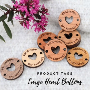 May include: Wooden round tags with a heart cut out in the centre. The tags are engraved with the text "Handmade by Minnies".