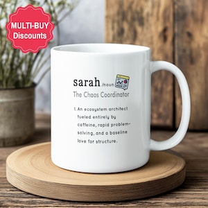 May include: A white ceramic mug featuring black text that defines the name Sarah as The Chaos Coordinator, describing an ecosystem architect fuelled by caffeine, rapid problem-solving, and a baseline love for structure, with a small chart icon.