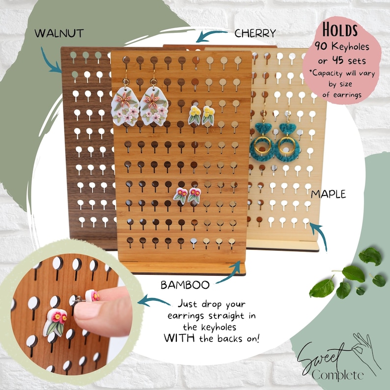 May include: A wooden earring display stand with 90 keyholes, shown in four different wood finishes: walnut, cherry, maple, and bamboo. The stand is designed to hold earrings with the backs on. The text "HOLDS 90 Keyholes or 45 sets *Capacity will vary by size of earrings" is visible in the image.