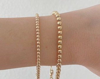 Braccialetti con perline riempiti d'oro: gioielli impilabili in argento sterling e oro rosa - Italia