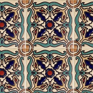 May include: Four square ceramic tiles with a repeating pattern of stylized floral designs in shades of blue, red, yellow, and green on a cream background.