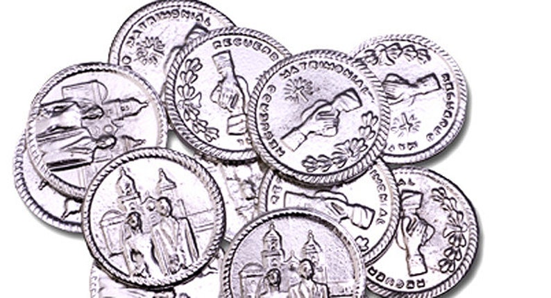 May include: A collection of silver-toned metal tokens with various designs. Some tokens feature a building with a dome, while others depict two hands shaking. The tokens have a raised rim and a smooth surface.