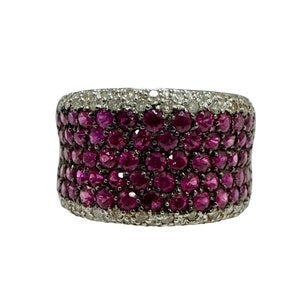 May include: A wide band ring with a row of small pink rubies and a row of small white diamonds.