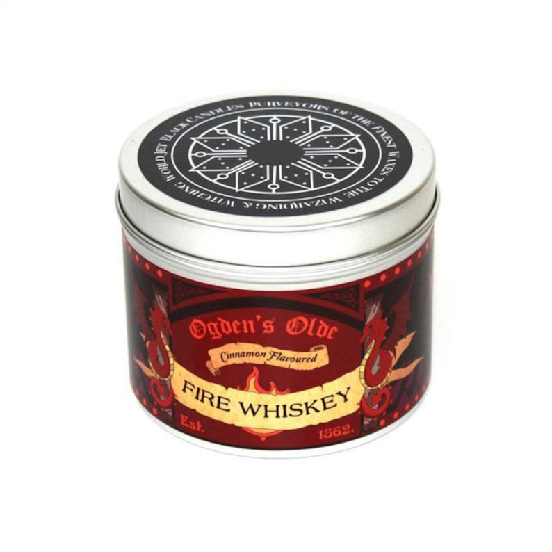 May include: A silver tin candle with a red label that says "Ogden's Olde Cinnamon Flavoured FIRE WHISKEY Est. 1862."