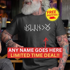 A man with a long beard wearing a black Runes Norse Mythology t-shirt with white text and a red arrow pointing to a red box with a "FREE SHIPPING" sticker.