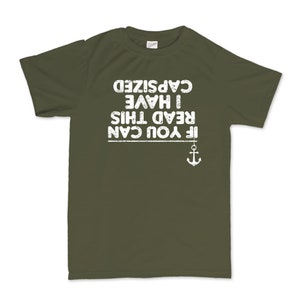 May include: A green t-shirt with white text that reads "If you can read this I have capsized". There is a small anchor graphic below the text.