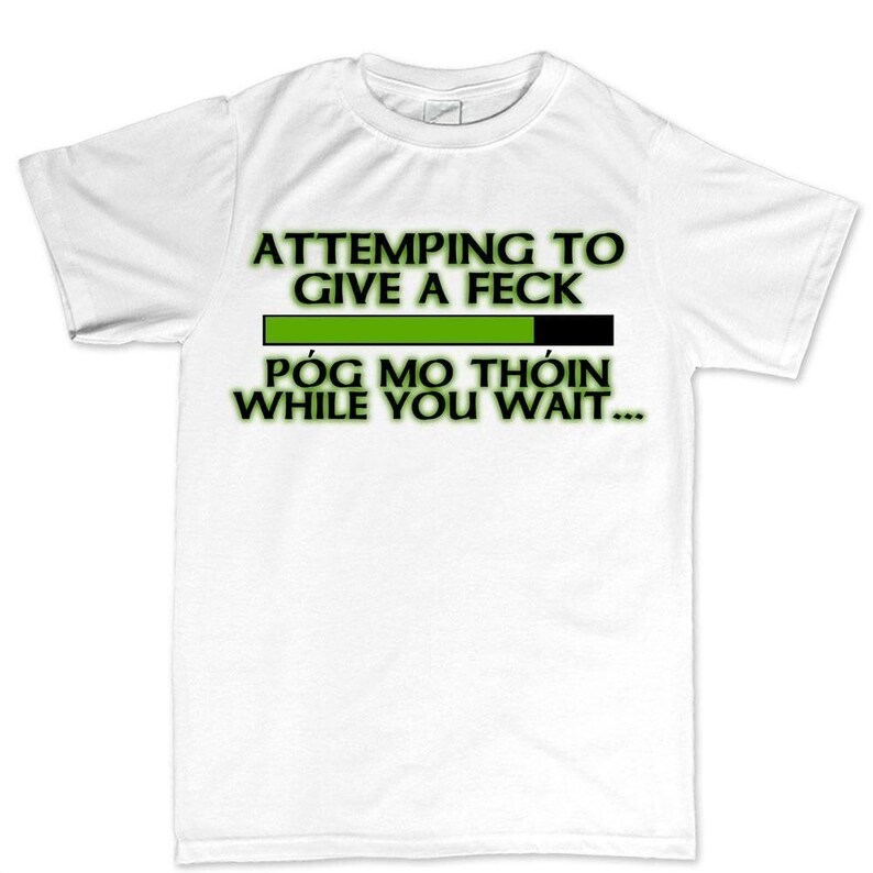 The image is a white t-shirt with a humorous text printed on it.