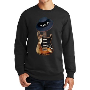 May include: A black sweatshirt with a distressed electric guitar and a black cowboy hat with white accents printed on the front.