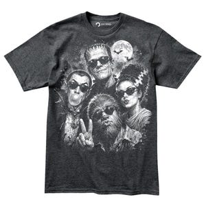 A t-shirt design featuring the iconic characters from the horror film "The Bride of Frankenstein", including Frankenstein's monster, Mary Shelley, and other supernatural beings.