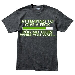A gray t-shirt with a humorous text printed on it.