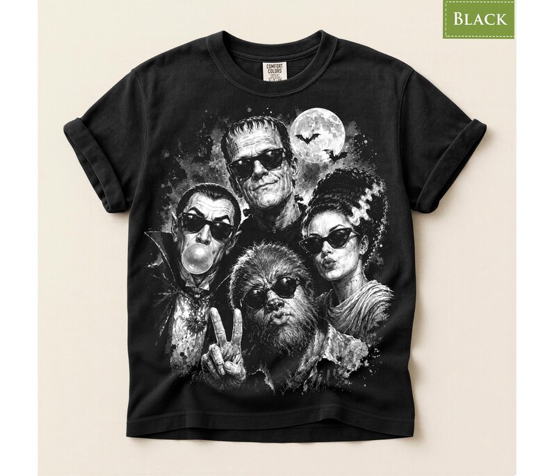 A black and white t-shirt with a graphic design featuring the faces of the characters from the horror movie "The Bride of Frankenstein".
