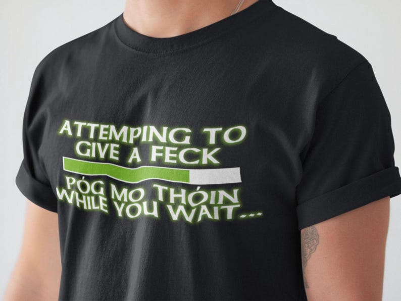 A black t-shirt with a humorous text printed on it.