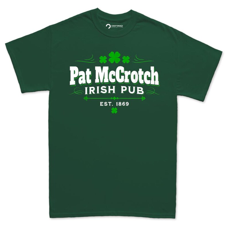 A green t-shirt with white text and graphics, including a clover design, that reads "Pat McCroch Irish Pub EST. 1869".