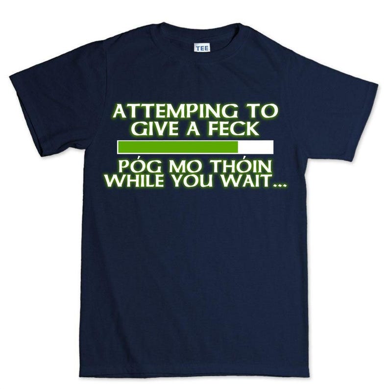 The image is a dark blue t-shirt with a humorous text printed on it.