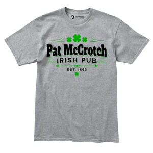 A gray t-shirt with the text "Pat McCroch Irish Pub EST. 1969" printed on it, along with four green shamrocks.