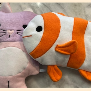 Hot water bottle it to hold PJs! These cozy animal pillows just  for cuddling, can also hold either!